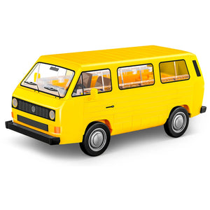 Gelber Cobi 24634 VW Transporter T3 Klemmbausteine Vitrinenmodell Maßstab Skala 1:35 mit drehbaren Gummireifen und bedruckten Steinen Frontansicht für Erwachsene Sammler zum Selberbauen mit offizeller VW Volkswagen Lizenz